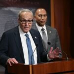 US Senate Minority Leader Chuck Schumer (L), D-NY, speaks to reporters as House Minority Leader Hakeem Jeffries, D-NY, looks on at the US Capitol in Washington, DC, on September 29, 2025, after meeting with Republican Leadership and US President Donald Trump about a potential government shutdown.